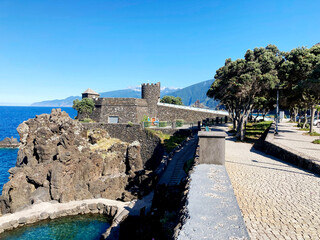 The Fort of São João Baptista das Berlengas, also known as the Fort of the Berlengas located on the western coast of Portugal. Natural swimming pool in foreground, blue skies on a sunny day