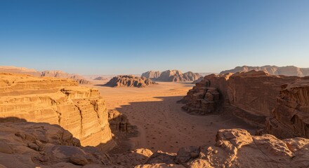 Panoramic view of a desert landscape with rocky formations at sunset