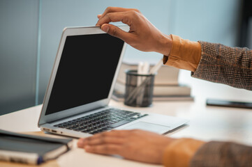 Close up picture of mans hands on the laptop