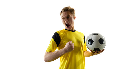 Emotional man, soccer player in yellow jersey holding ball and shouting in excitement, motivation...