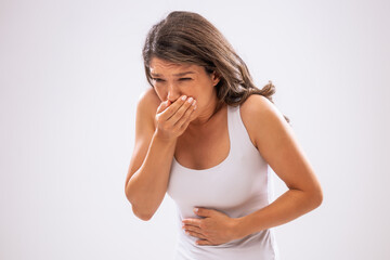 Fototapeta premium Portrait of adult woman who is having nausea.