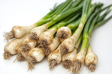 Bunch of onions and loose ones on white surface.