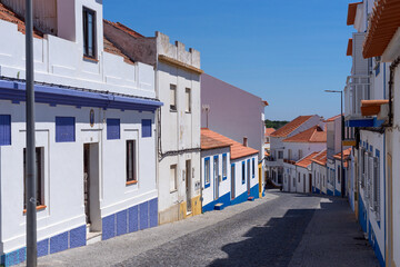 Street of the beautiful fishing village of Vilanova de Milfontes in the Alentejo region of Portugal in a sunny day.
