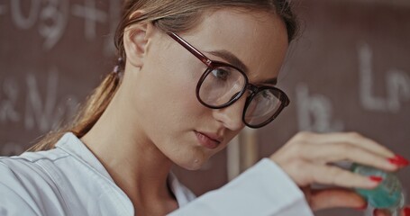 A Young Scientist is Actively Conducting an Interesting Experiment in the Laboratory Environment