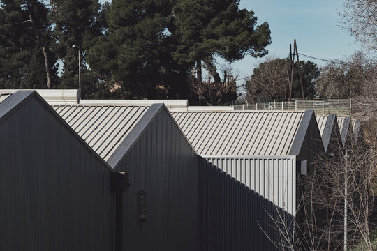 Industrial warehouse with metal sheet roofing in a functional architectural style.