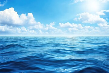 Vast ocean under a vibrant sky.  Sunlit waves meet a cloud-studded azure sky