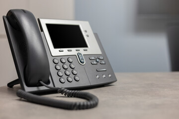 close up telephone VOIP technology standing on office desk in office room for network operation...