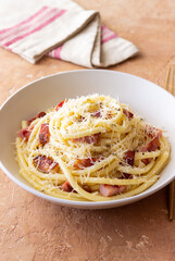 Pasta bucatini carbonara with cheese and pancetta. Italian food.