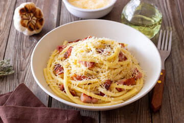Pasta bucatini carbonara with cheese and pancetta. Italian food.