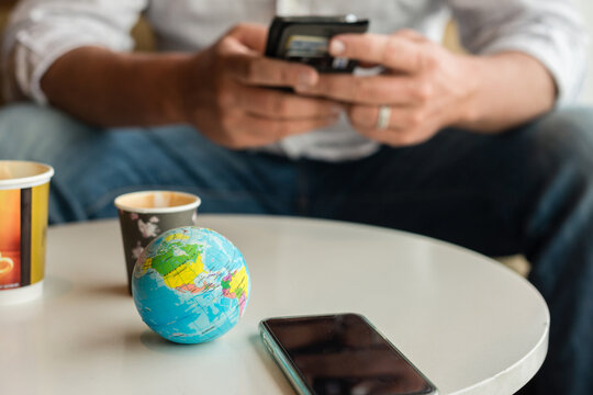 travel concept with globe, wating at the airport