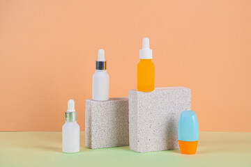 Plastic white tube for cream or lotion. Skin care or sunscreen cosmetic with stylish props and palm leaves shadow.