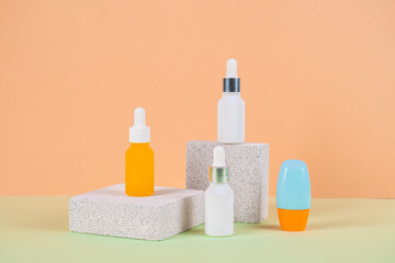 Plastic white tube for cream or lotion. Skin care or sunscreen cosmetic with stylish props and palm leaves shadow.