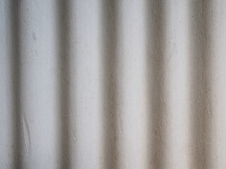 Gray cement wave roof, texture background. Texture of fiber cement roof sheet. Close up of corrugated wave asbestos tile