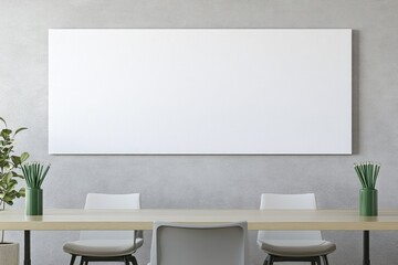Empty canvas on a wall, above a light wooden table with two white chairs