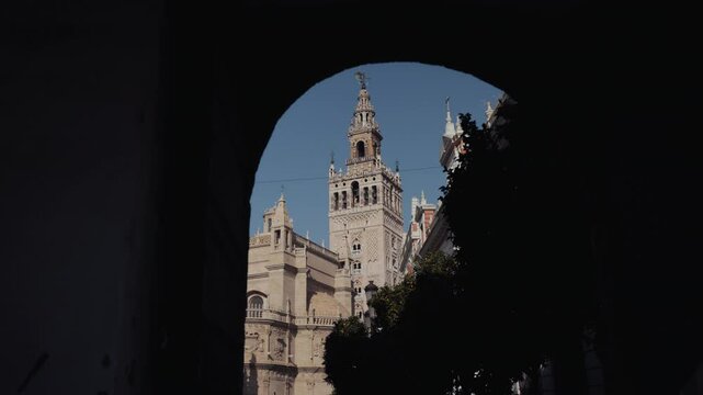 A picturesque view of the Giralda, the Cathedral, and orange trees, showcasing Seville&rsquo;s architectural beauty