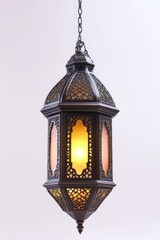 Ornate hanging lantern with warm glow. Intricate metalwork and frosted glass create a beautiful decorative light fixture