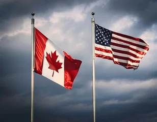 Wall murals canada flag and united states flag waving in the same direction  cloudy and dark sky