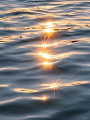 Fototapeta premium Golden Hour Sea Reflections - Serene sunset, rippled water, golden light, tranquil scene, nature's beauty. Symbolizing peace, hope, serenity, reflection, and renewal