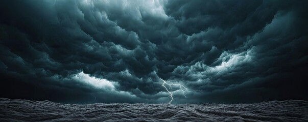 Dark sky concept. Dramatic stormy sky with dark clouds and lightning illuminating the ominous atmosphere.