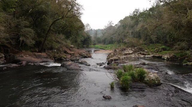 Flowing river in Parque Natural Gruta India, Misiones, Argentina surrounded by nature