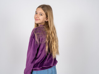 Satisfied pretty beautiful teen girl wearing purple sweater beaming smile look camera