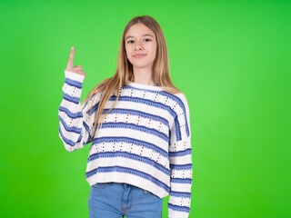 beautiful teen girl wearing striped sweater smiling and looking friendly, showing number one or first with hand forward, counting down
