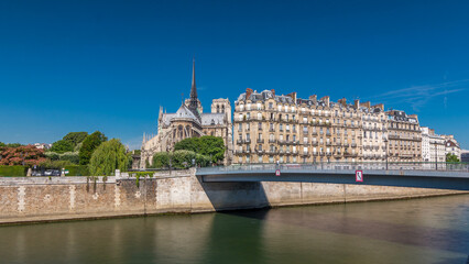 Naklejka premium Seine and Notre Dame de Paris timelapse hyperlapse is the one of the most famous symbols of Paris