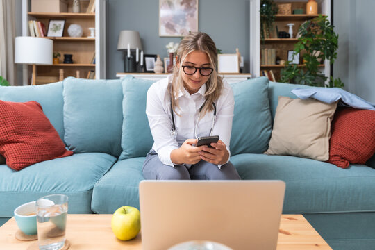 Telemedicine. Young woman doctor working at home office, private general practitioner, healthcare and medical female worker using laptop computer for contact with senior patients Helping people online - Powered by Adobe