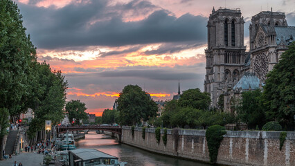 Cathedral Notre Dame de Paris day to night timelapse after sunset in Paris, France.