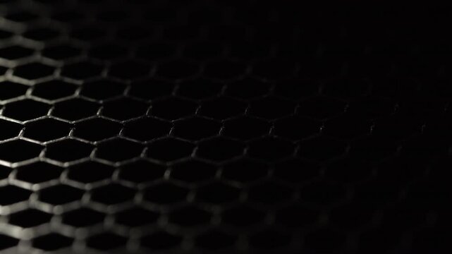 dark metallic hexagonal grid with dramatic lighting