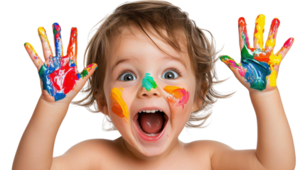 Cheerful young boy explores his creativity by playing with colorful paints spreading his painted hands in a joyful and expressive manner