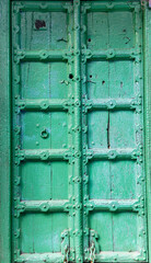artistic entrance wood door at old city street at morning