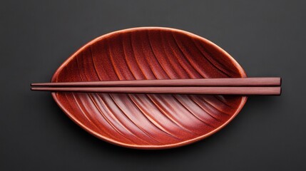 Elegant Display of Wooden Chopsticks on Artistic Leaf-Shaped Plate
