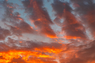 Partly cloudy sky with orange clouds at sunset. Sunset backdrop photo