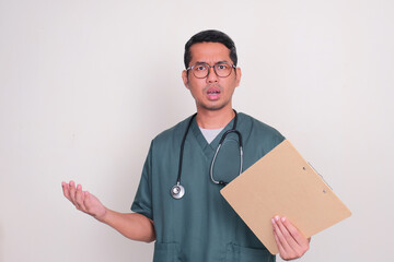 Male hospital nurse showing confused face expression