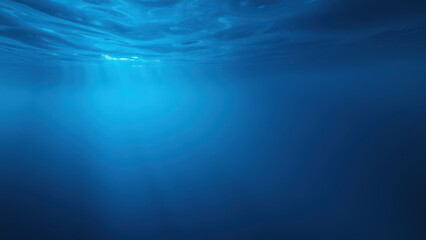 a blue ocean with a light shining through the water,