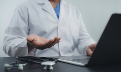 Doctor extending a hand during a virtual consultation, symbolizing professional communication and...