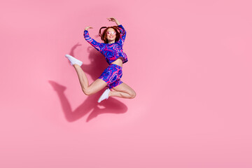 Photo of positive girl,jumping dancing ballet acrobatics isolated pastel color background