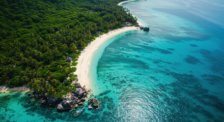 Aerial view of a tropical island showcasing white sand beaches, clear turquoise water, and lush vegetation.