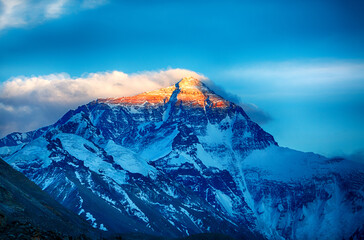 Breathtaking view of Mount Everest’s summit merging with the clouds, captured from Tibet. The...