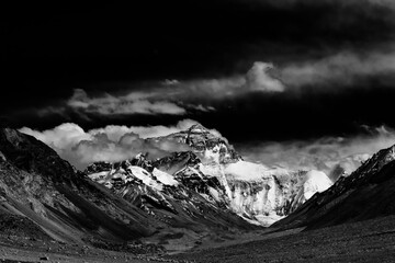 Breathtaking view of Mount Everest’s summit merging with the clouds, captured from Tibet. The...