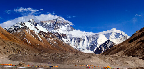 Breathtaking view of Mount Everest’s summit merging with the clouds, captured from Tibet. The...