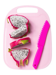 Pink cutting board with sliced ​​dragon fruit and knife on it, isolated on white background