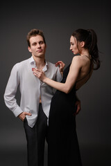 Couple in stylish outfits sharing a romantic moment together