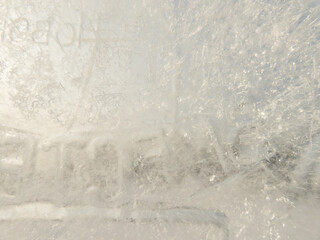 Ice texture background. Textured cold frosty surface of ice block with frozen air bubbles.