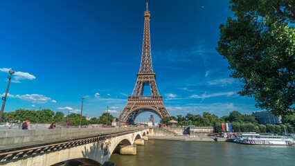 Eiffel Tower with bridge over Siene river in Paris timelapse hyperlapse, France