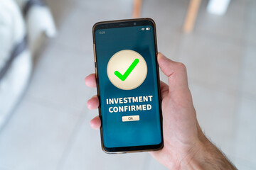 Investment confirmed notification on smart phone.
