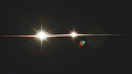 Two bright lights with lens flare and radiating star shapes