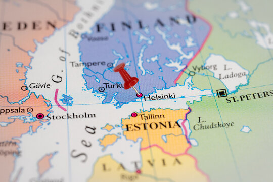 Colorful tourist location map with red stick pin at  Helsinki, Finland, and the surrounding countries