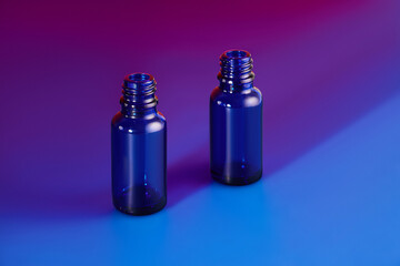 Blue glass jars without logos for mockups of medicines, vitamins, cosmetics